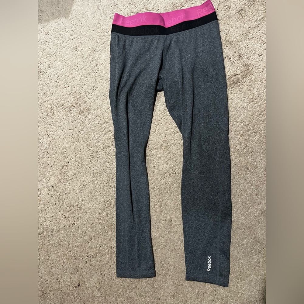 Women’s full length grey Redbox workout leggings with pink & black around top.